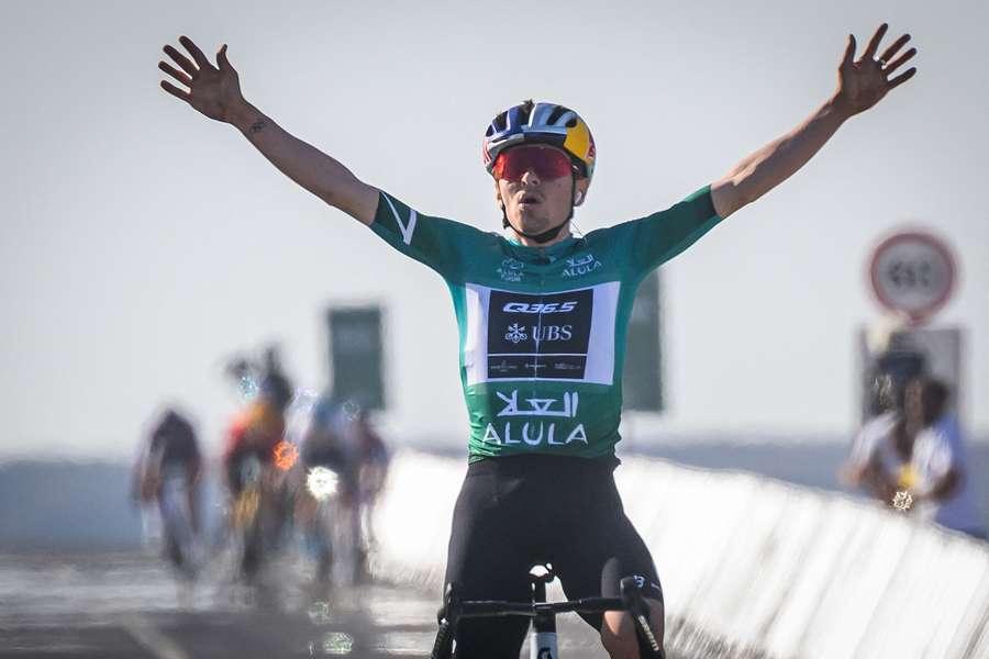 Team Q36.5's Tom Pidcock celebrates as he crosses the finish line to win the fourth stage of the AlUla Tour
