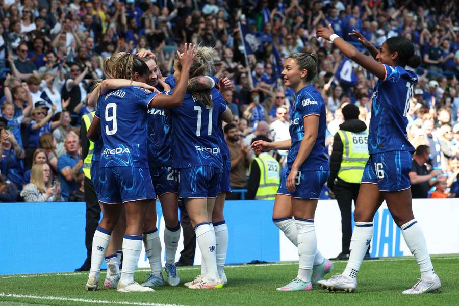 Chelsea's Agnes Beever-Jones celebrates scoring their first goal with teammates