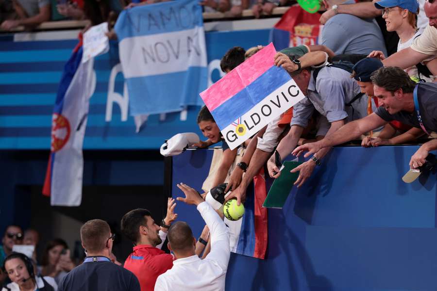 Novak Djokovic greets his fans after his semi-final win