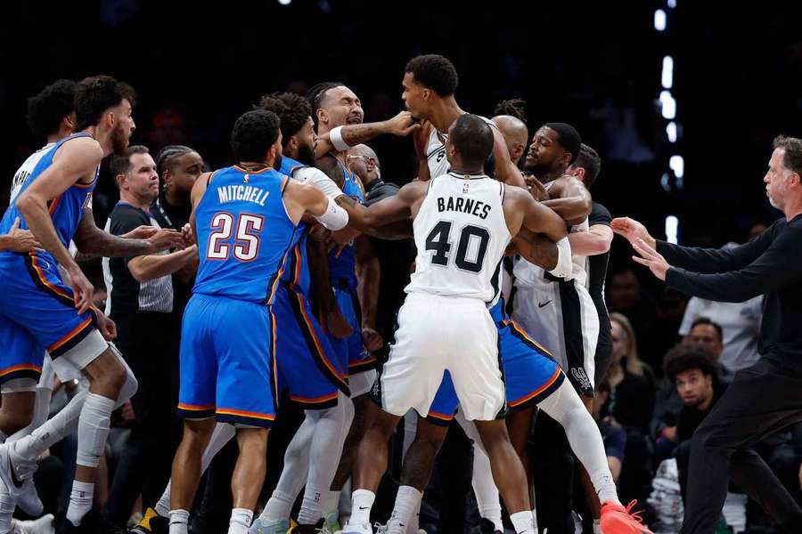 Players from both teams engage in a tussle Players from both teams engage in a tussle