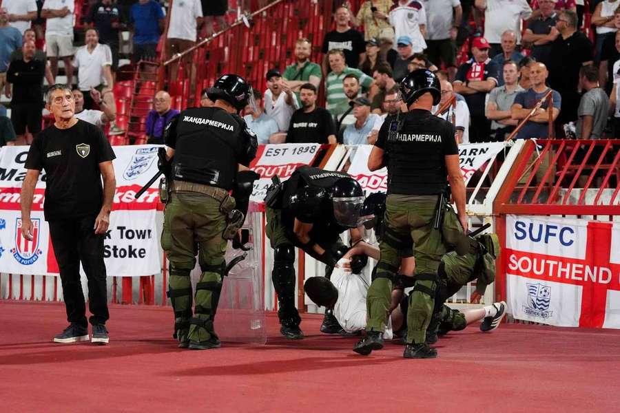 A Serbia fan is apprehended by police