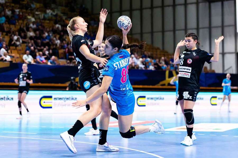 Team Esbjerg's Henny Reistad tries to stop Krim's Eleonora Stankovic 