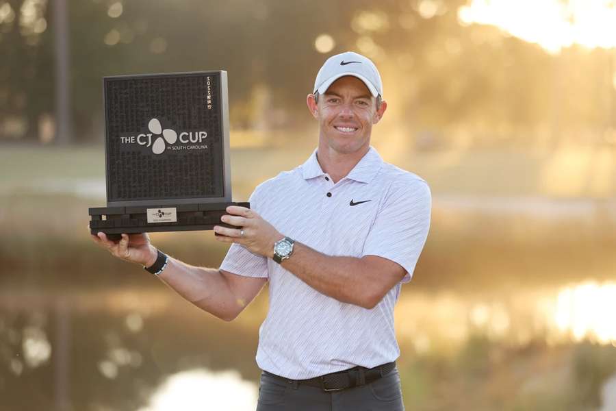 Rory McIlroy celebrates with the trophy after winning during the final round of the CJ Cup at Congaree Golf Club