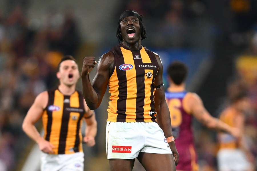 Hawthorn's Mabior Chol celebrates a goal kicked against Brisbane on Sunday night.
