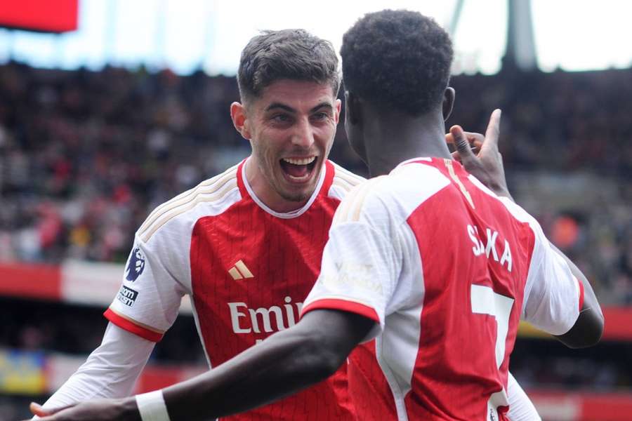 Bukayo Saka of Arsenal celebrates his goal from the penalty spot with Kai Havertz