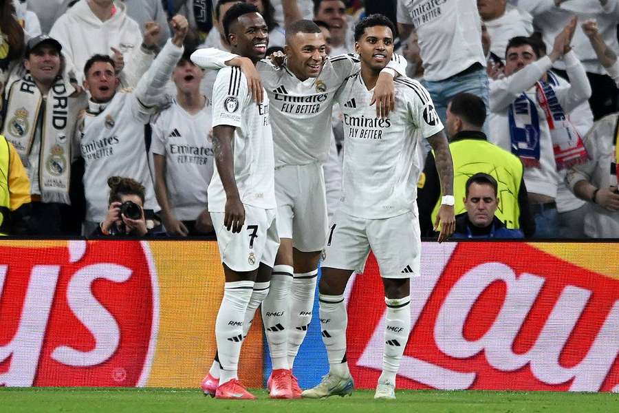 Kylian Mbappé with Vinicius Jr and Rodrygo Goes after his goal against Salzburg