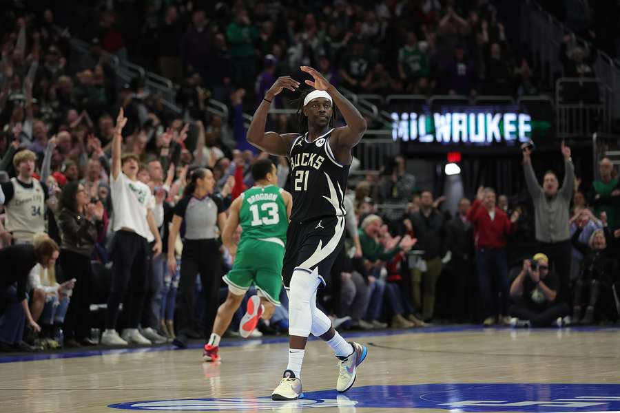 Jrue Holiday of the Milwaukee Bucks reacts to a three-point shot in overtime against the Boston Celtics