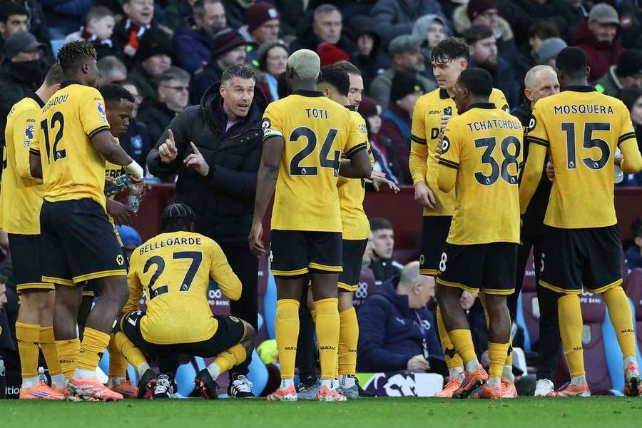 Wolves' Rob Edwards talks to his players during the game against Aston Villa