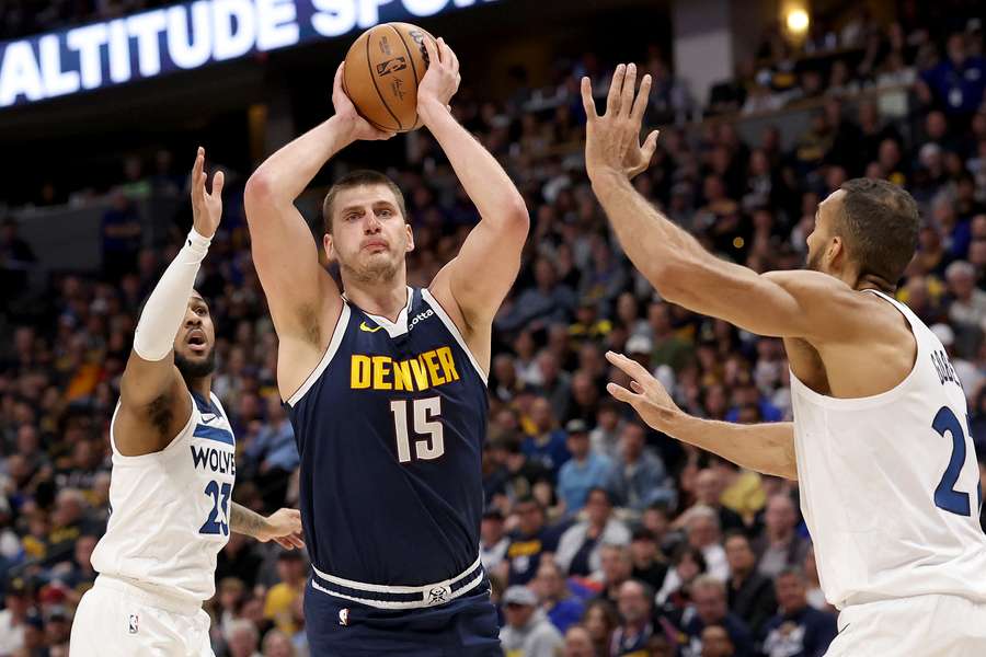 Jokic (C) in action for the Nuggets