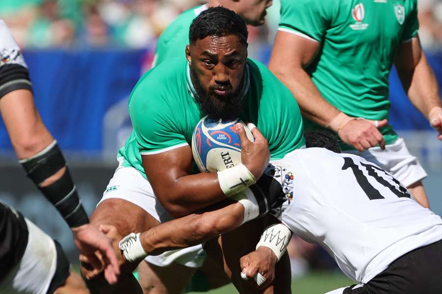 Ireland's centre Bundee Aki in action against Pool B rivals Romania