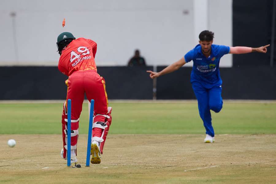 Zimbabwe's Tadiwanashe Marumani is bowled by Afghanistan's Azmatullah Omarzi 