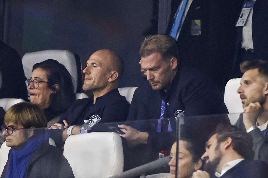 Ajax technical director Alex Kroes (L) and Director of Football Marijn Beuker look on during Ajax's 4-0 loss away at Olympique Marseille