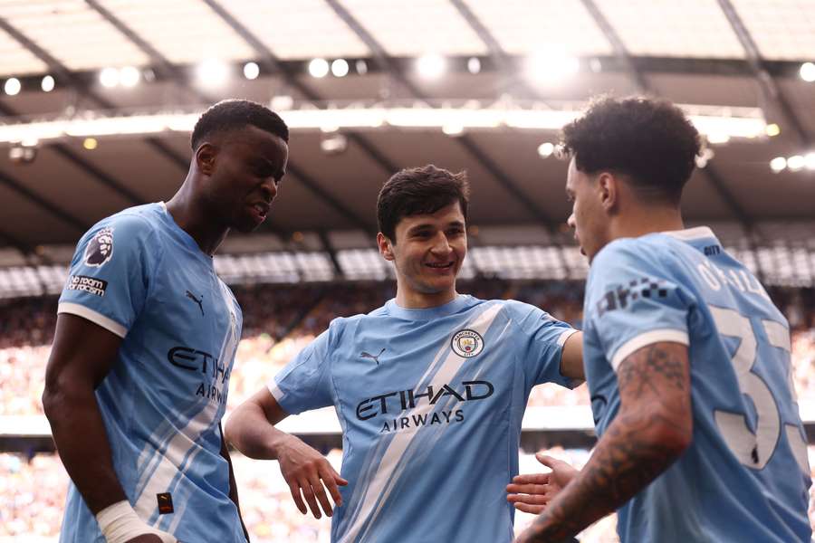 Les joueurs de Manchester city célébrant un but.