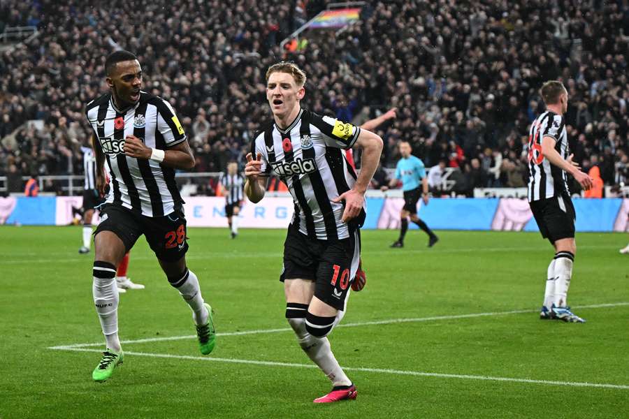 Anthony Gordon runs away in celebration after scoring Newcastle's winning goal
