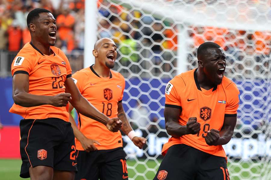 The Netherlands' Brian Brobbey (R) celebrates scoring the 1-0 against Sweden with Donyell Malen (#18) and Denzel Dumfries (#22) The Netherlands' Brian Brobbey (R) celebrates scoring the 1-0 against Sweden with Donyell Malen (#18) and Denzel Dumfries (#22)