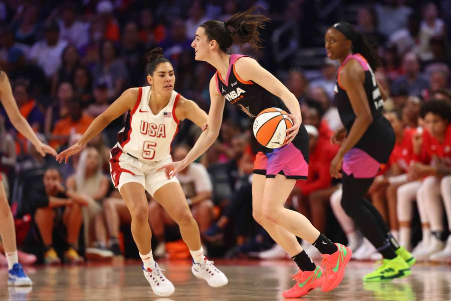 Team WNBA guard Caitlin Clark, right, against USA Women's National Team player Kelsey Plum