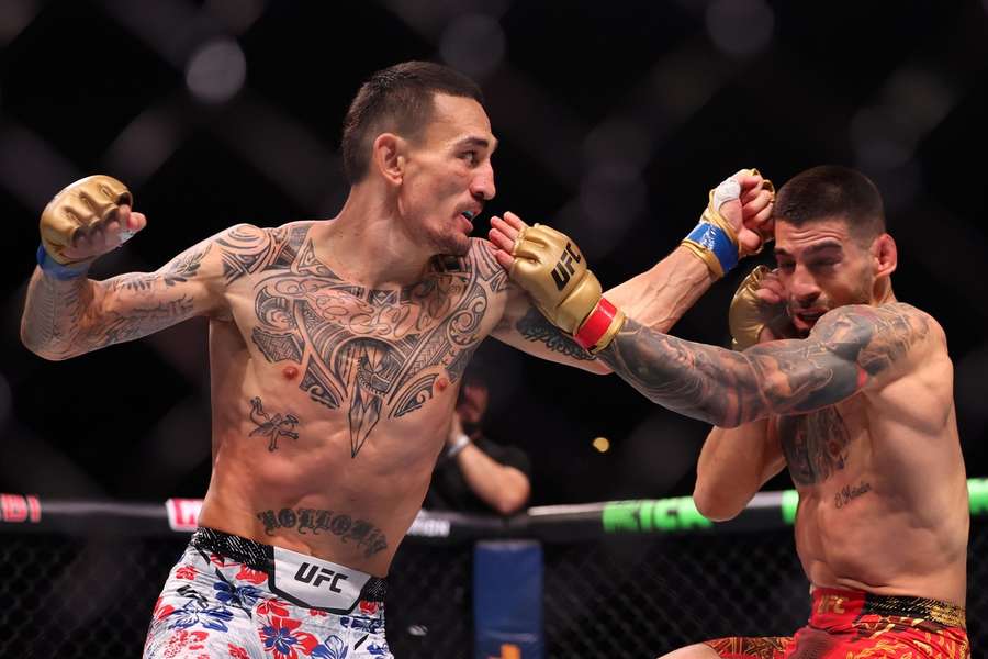 Illia Topuria and Max Holloway, left, in action