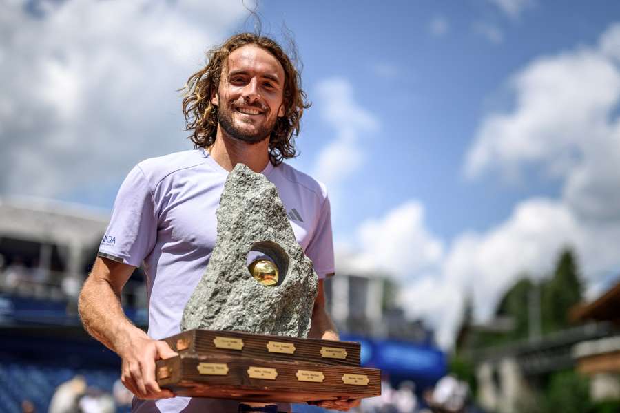 Stefanos Tsitsipas poses with the trophy following his victory against Raphael Collignon Stefanos Tsitsipas poses with the trophy following his victory against Raphael Collignon