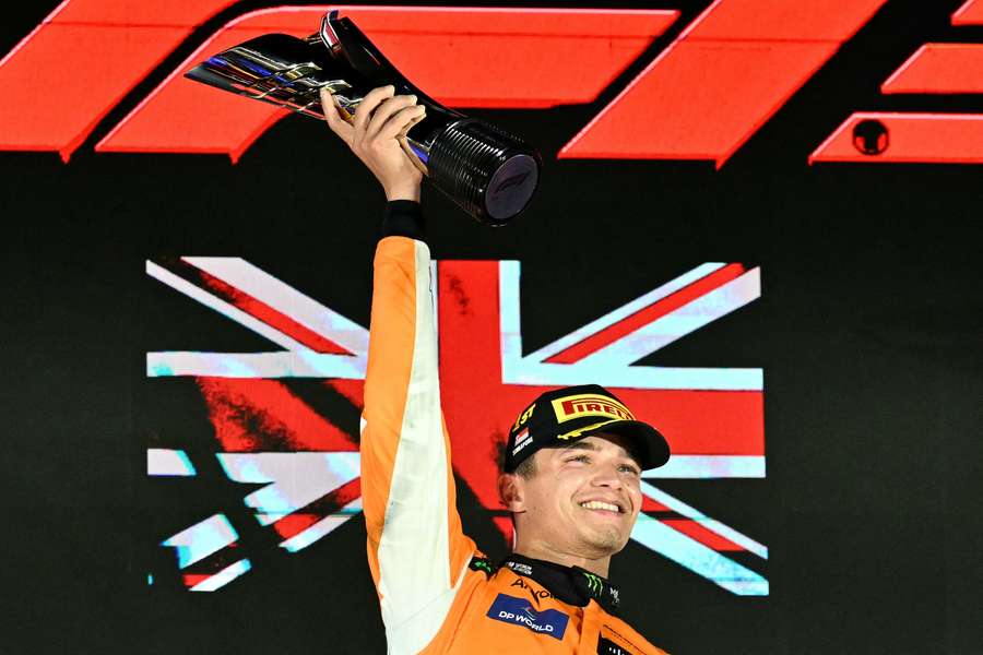 McLaren's British driver Lando Norris celebrates after winning the Formula One Singapore Grand Prix