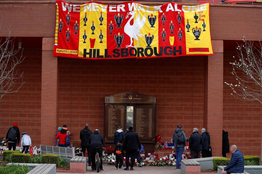 People pay their respects at the Hillsborough Memorial