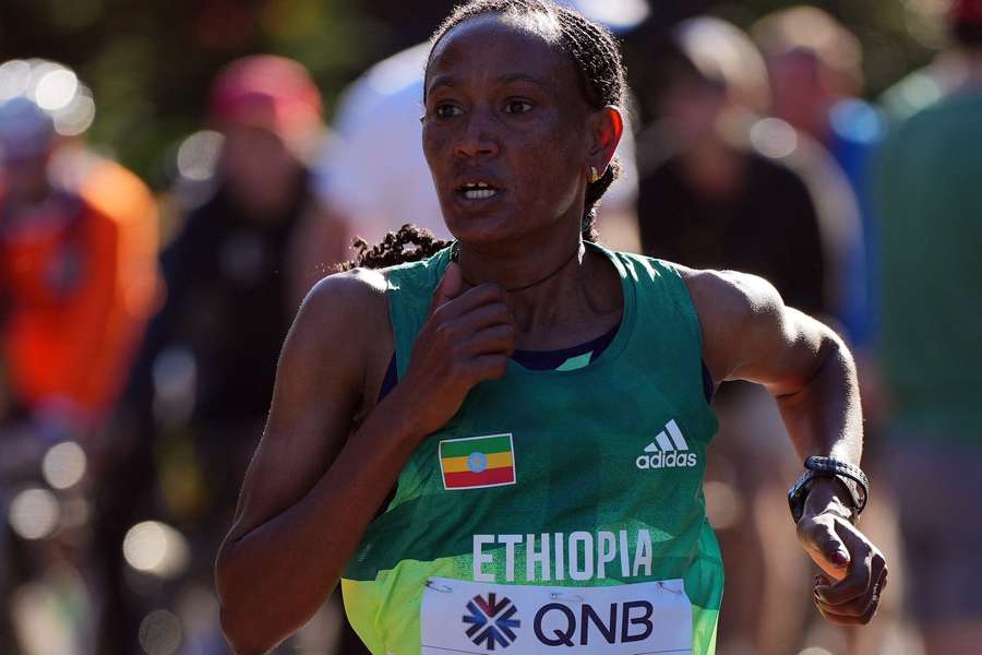 Gotytom Gebreslase kicked with two kilometres to go to win in championship-record time