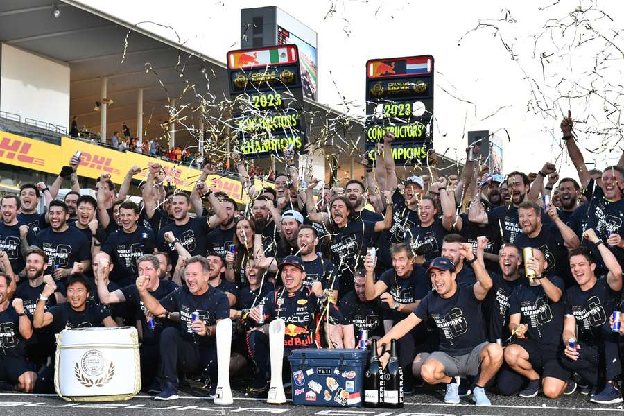 Red Bull's Max Verstappen, team principal Christian Horner, Sergio Perez and team members celebrate winning the Formula 1 constructors' championship