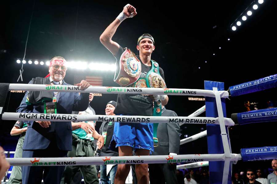 WBC/WBO super welterweight champion Sebastian Fundora celebrates after beating Chordale Booker in Las Vegas
