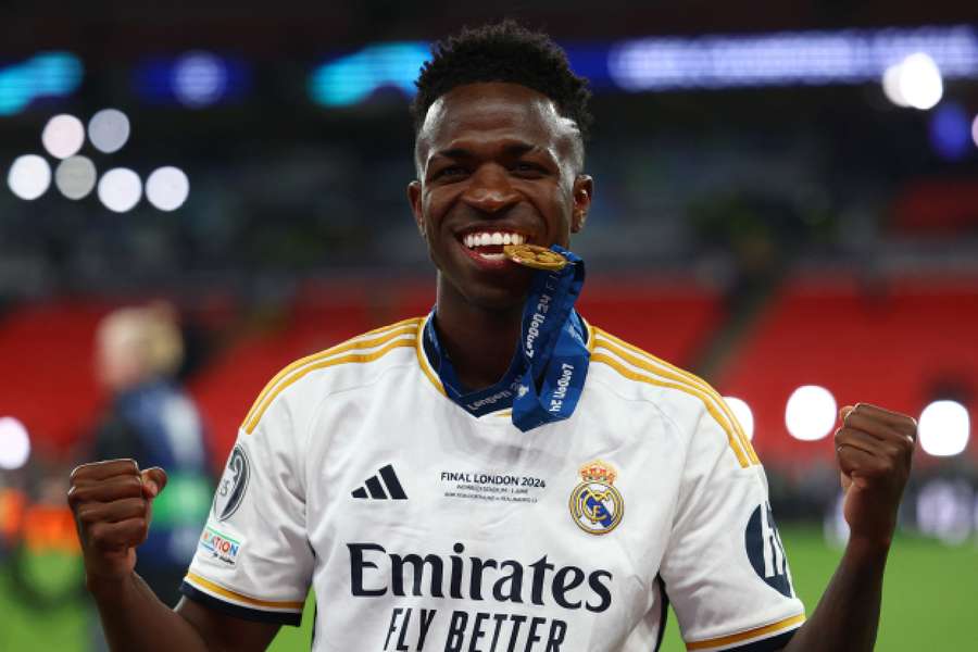 Vinicius celebrates winning the Champions League with winners medal