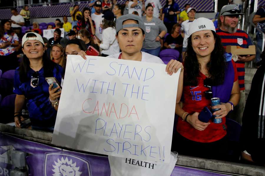 A spectator holds a sign in support of the Canadian National Women's Team during the SheBelieves Cup in February
