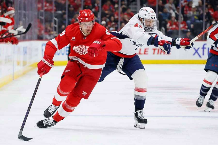 Ben Chiarot races Tom Wilson down the ice during the second period 