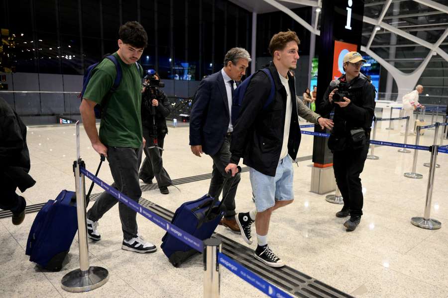 Hugo Auradou (L) and Oscar Jegou (2nd R) and their lawyer Rafael Cuneo Libarona (C)