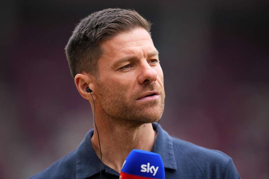 Xabi Alonso speaks to the press before his switch to Real Madrid