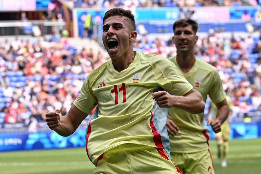 Fermin Lopez (left) celebrates scoring for Spain