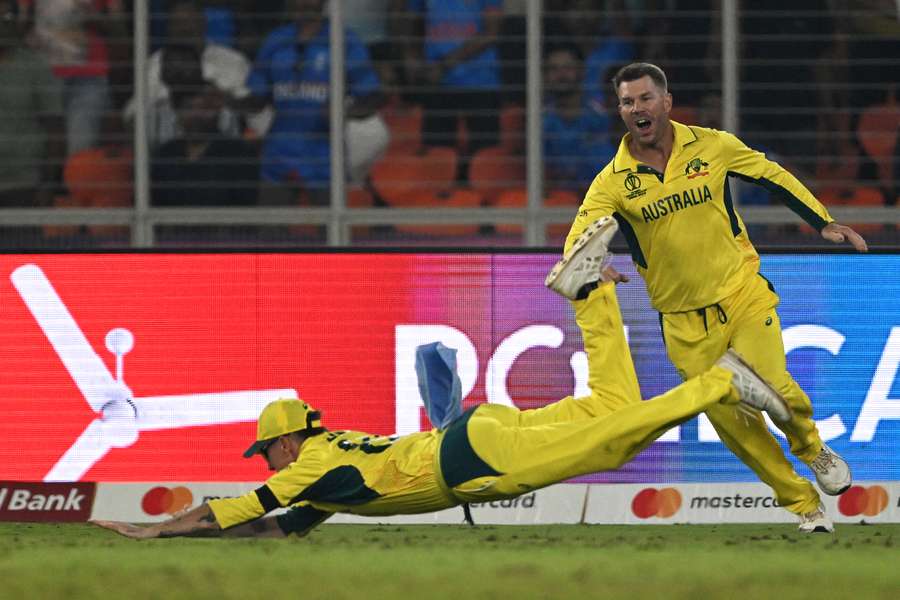 Australia's Adam Zampa (L) takes the catch to dismiss England's David Willey