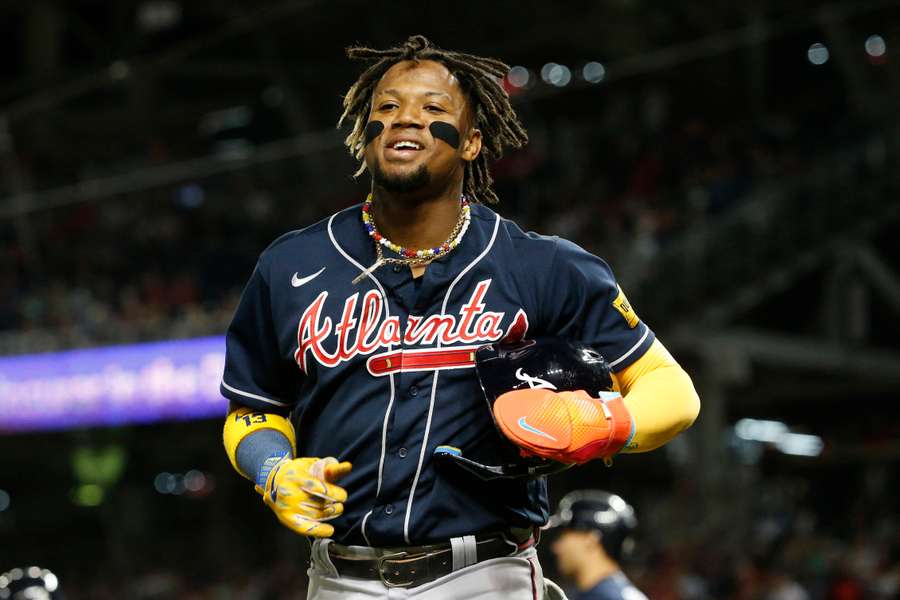 Acuna Jr. celebrates after scoring a run in the fifth inning against the Nationals