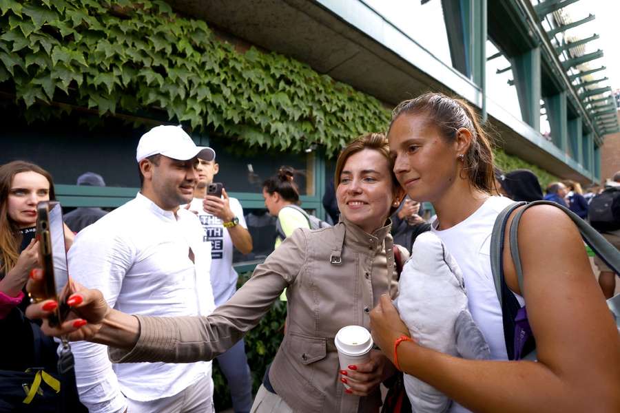 Kasatkina poses with a fan after her win