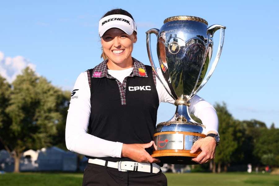 Canada's Brooke Henderson poses with the trophy