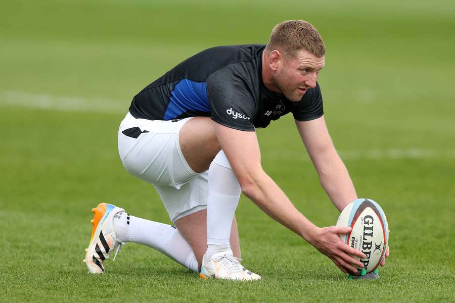Finn Russell lines up a kick in a Premiership game for Bath.