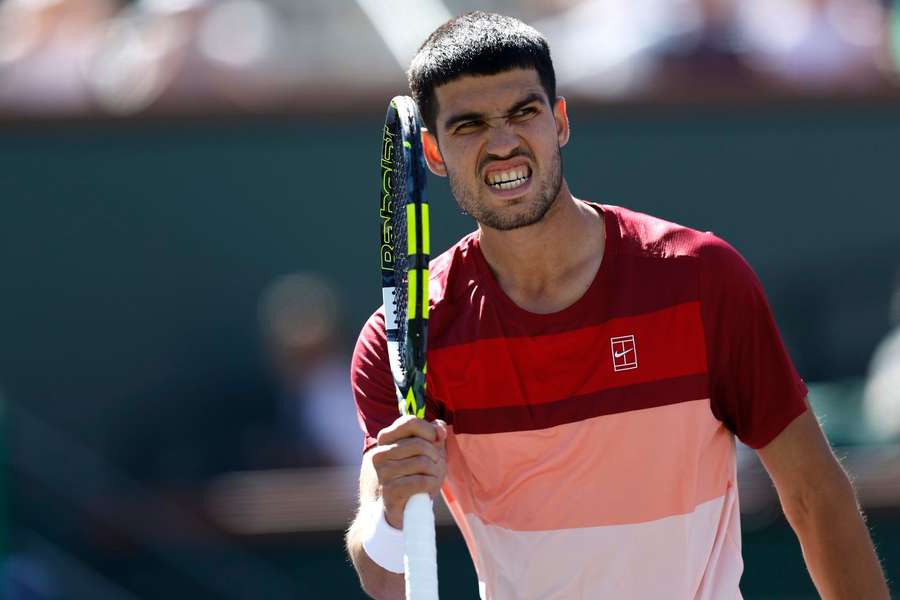 Carlos Alcaraz of Spain gestures after winning a point against Quentin Halys