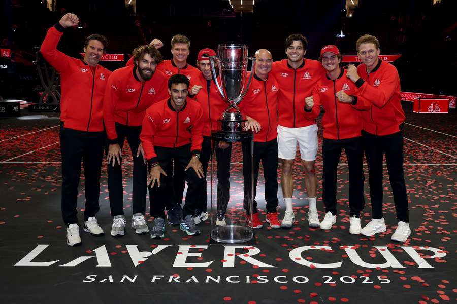 Team World pose with the Laver Cup trophy.