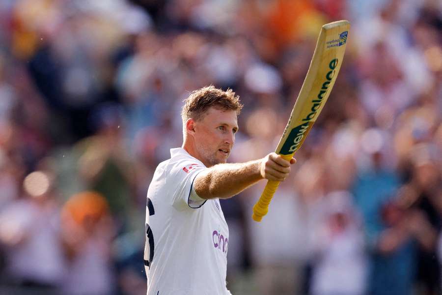 Root celebrates his century