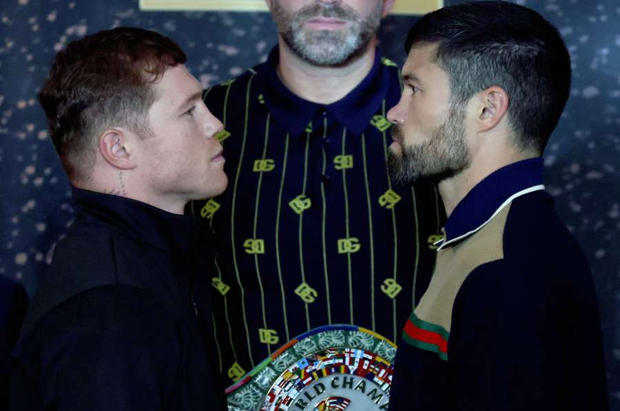 Alvarez (L) stares down John Ryder