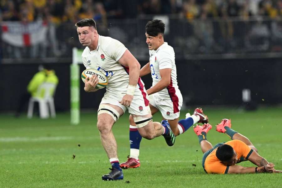 Tom Curry shrugs off a tackle during England's Test match against Australia in July.