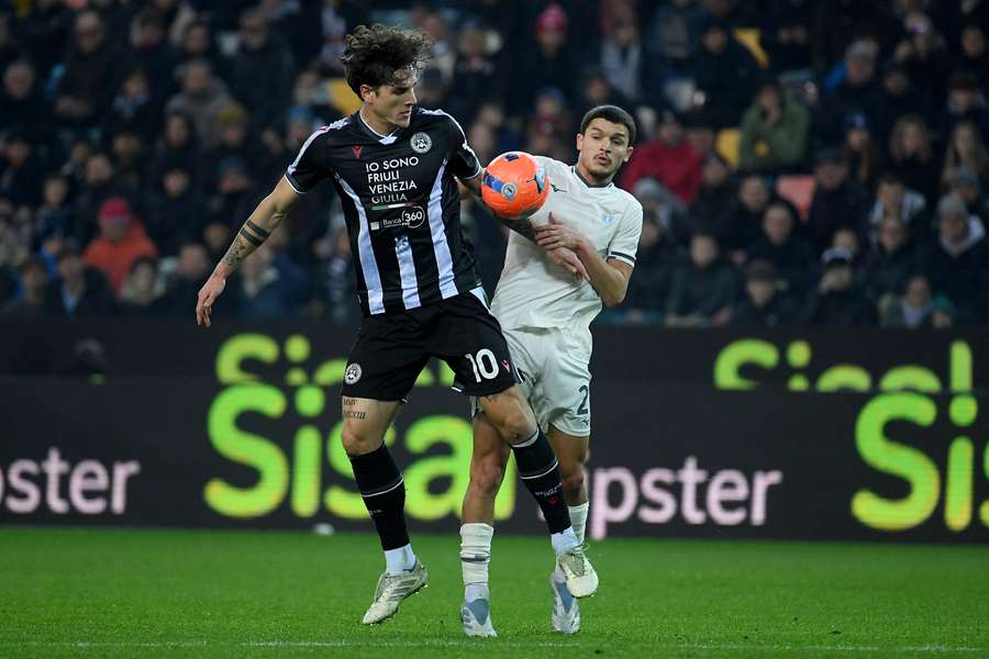 Reda Belahjane of Lazio competes for the ball with Nicolo Zaniolo