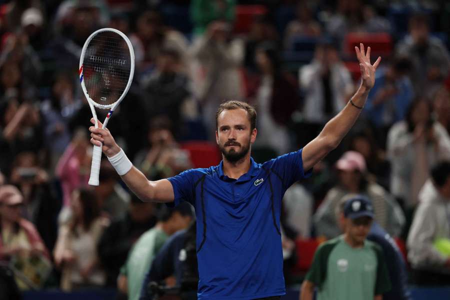 Daniil Medvedev celebrates winning his fourth-round match against Stefanos Tsitsipas