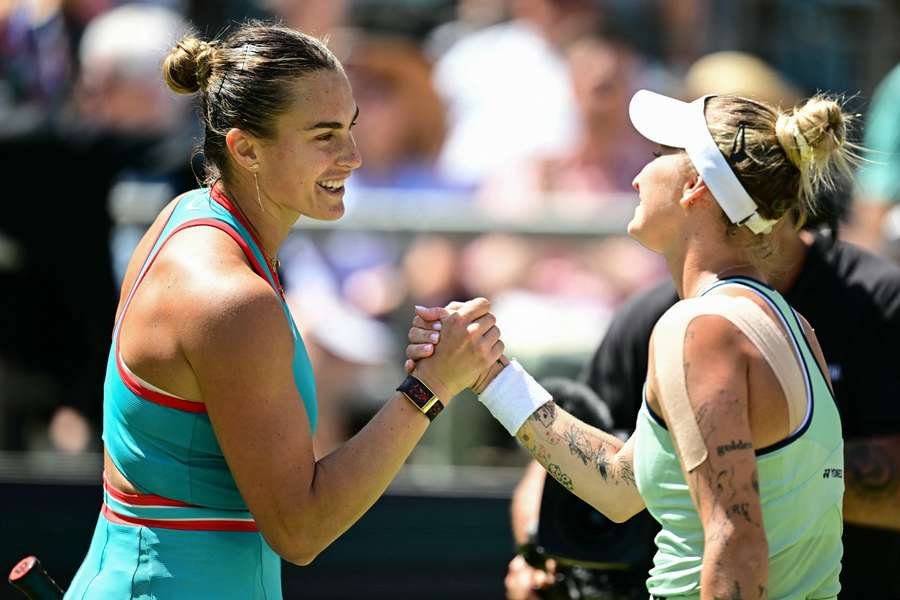 Aryna Sabalenka (L) congratulates Marketa Vondrousova