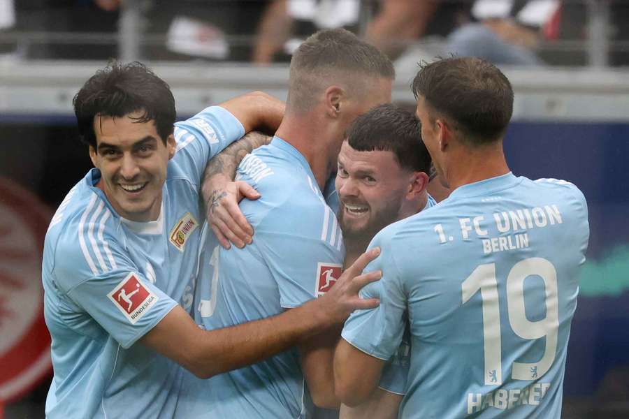 Union Berlin's Scottish forward Oliver Burke (second right) celebrates with teammates