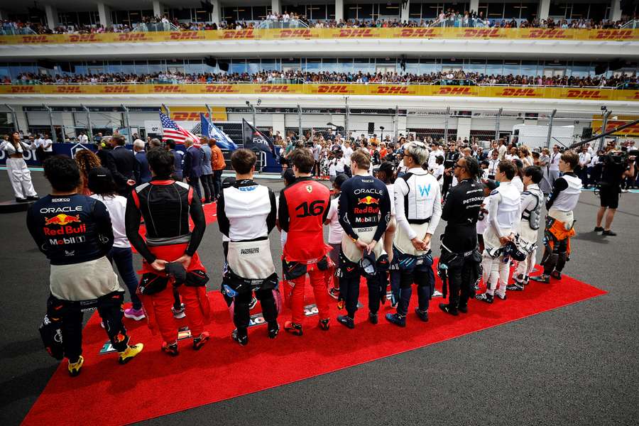 F1 drivers stand for the national anthem in Miami