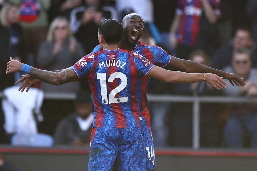 Jean-Philippe Mateta celebrates with Daniel Munoz after giving Crystal Palace a first-half lead