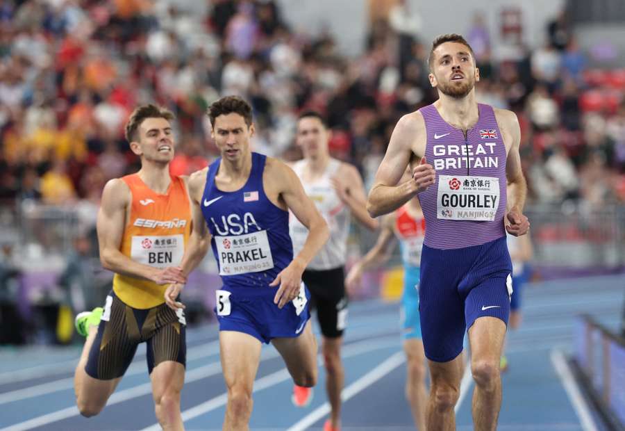 Neil Gourley crosses the finish line ahead of USA's Samuel Prakel and Spain's Adrian Ben